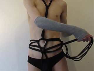 bondage femboy ties themselves in harness